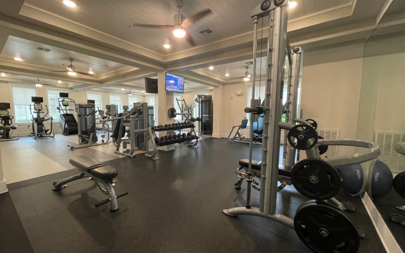 Fitness center with free weights and power rack at Novus Westshore