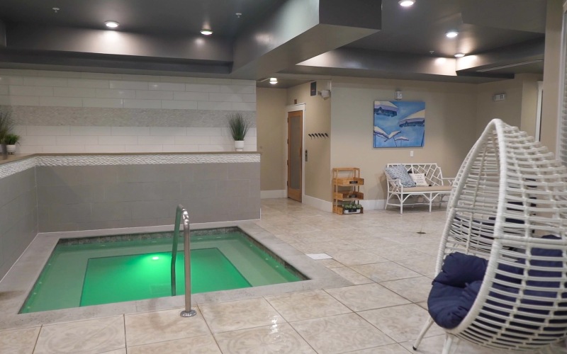 Wellness spa with sauna, and indoor hot tub at Novus Westshore